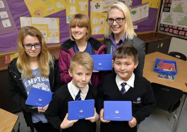 Pupils and staff at Manor Academy have been issued with Ipad's, pictured from left are Chloe Shelton, Emily Shelton, Principal Donna Trusler, Joe Collier and Leon Radford