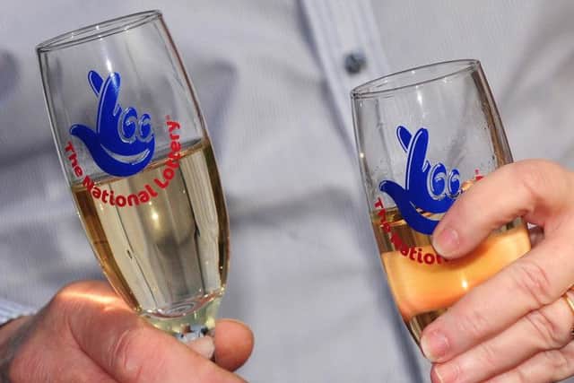 National Lottery champagne flutes as the Lottery will mark two decades of creating millionaires and supporting good causes when it whirs up its draw machine and brightly coloured balls today.Photo:  Rui Vieira/PA Wire
