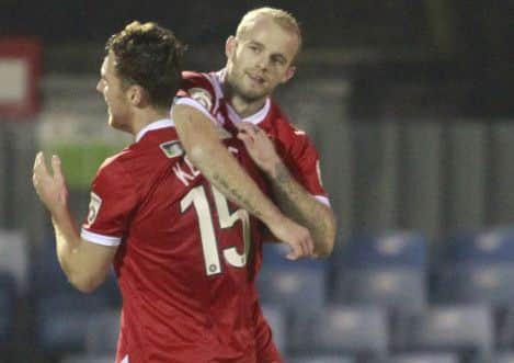 Jordan Keane congratulates Bradley Wood after scoring the only goal of the match -Pic by: Richard Parkes