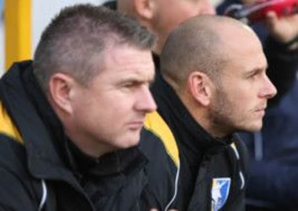 Micky Moore and Adam Murray on the Stags bench.