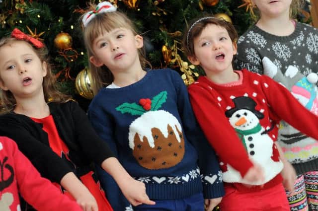 Pupils from the John T Rice Infant School entertain visitors to Kings Mill Hospital on Monday with their carol concert.