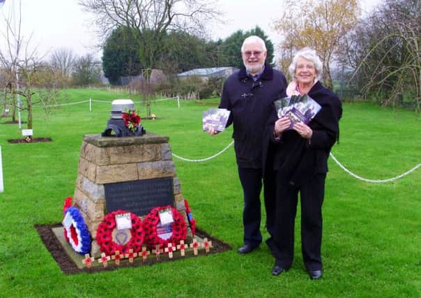 Howard Heeley from Newark Air Museum and Coun Maureen Dobson are pictured at the Winthorpe aviation memorial with copies of the booklet