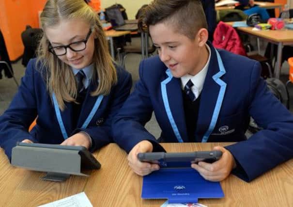 Students at Manor Academy are using their iPads as part of the curriculum on a daily basis, pictured are Bethany Fenton and Jaz Goundry