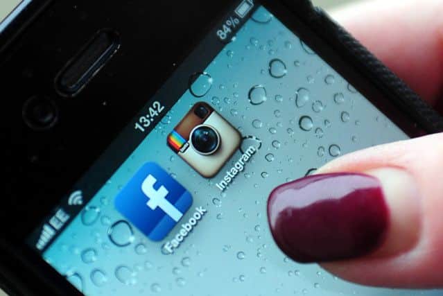 Instagram and Facebook logos on a smartphone