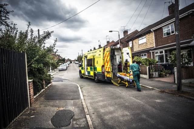 EMAS ambulance paramedic and stretcher - taken by Blast Films