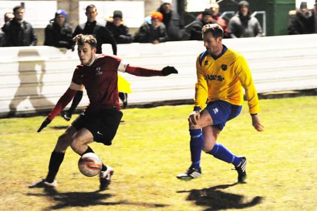 Shirbrook Town v AFC Mansfield.
Shirebrook's Will Dennis is chased down by Mark Dudley.