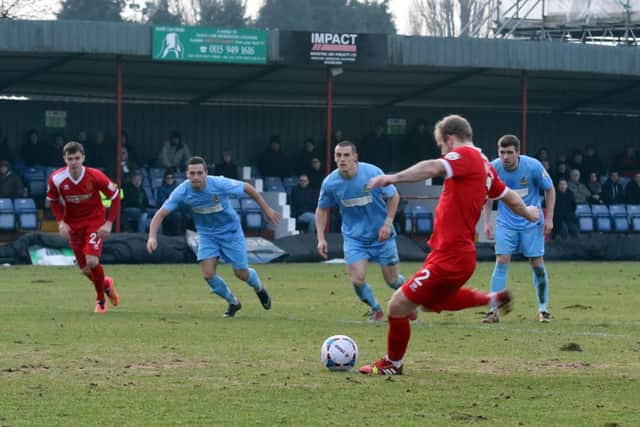 Bradley Wood tucks away the penalty after Tom Shaw was fouled in the area.