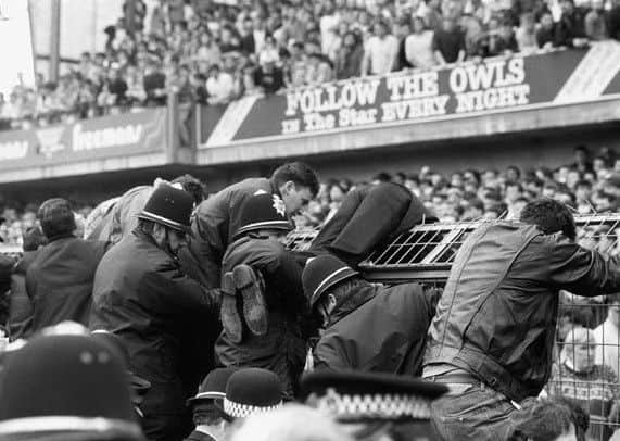 Fans try to escape the crush at Hillsborough.