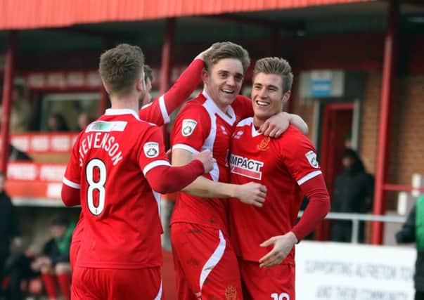 Callum Howe is congratulated by team mates after putting Alfreton 3-1 ahead.