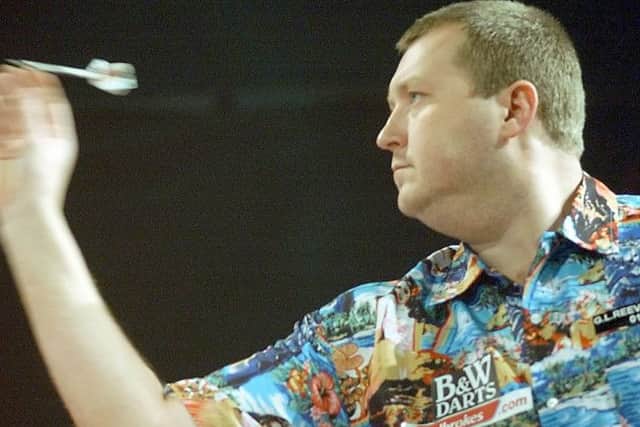 England's Wayne Mardle throws his dart during his quarter final match in the World Darts Championship against countryman Simon Whatley in Purfleet, London, Friday Jan.2, 2004.(AP Photo/Max Nash)