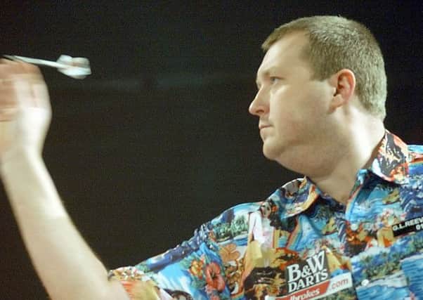 England's Wayne Mardle throws his dart during his quarter final match in the World Darts Championship against countryman Simon Whatley in Purfleet, London, Friday Jan.2, 2004.(AP Photo/Max Nash)