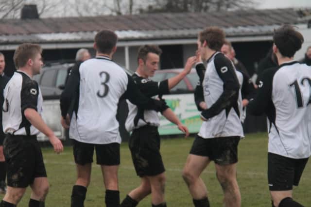 Swanwick's players celebrate the winning goal.