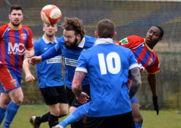 Ryan Granger wins a header for South Normanton
