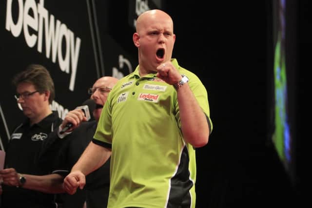 Michael Van Gerwen in action against Dave Chisnall.
