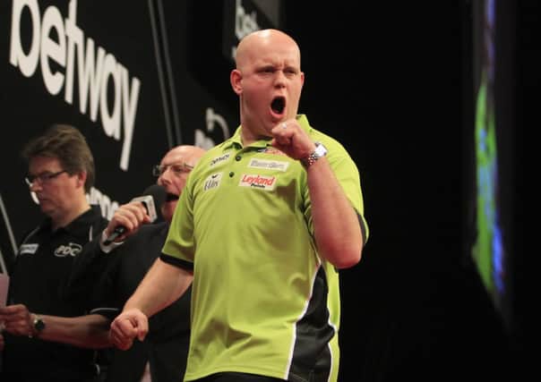 Michael Van Gerwen in action against Dave Chisnall.