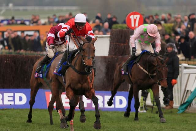 PURE GOLD -- Coneygree fends of Djakadam (right) and Road To Riches to become the first novice to win the Cheltenham Gold Cup for 41 years (PHOTO BY: Nick Potts/PA Wire).