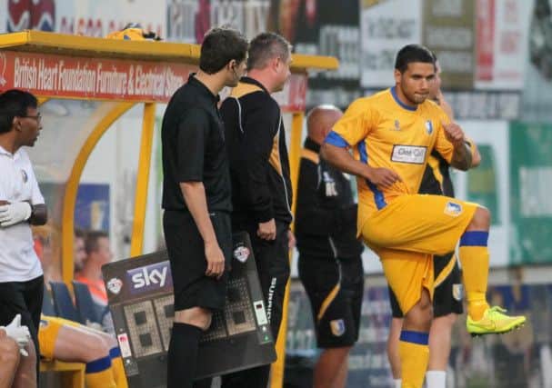 Liam Hearn prepares to enter the pitch as a second half substitute -Pic by: Richard Parkes