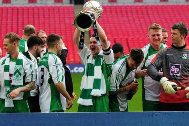 FA Trophy Final at Wembley Stadium.
North Ferriby United v Wrexham.
Ferriby's captain Liam King lifts the trophy.
29th March 2015.
Picture Jonathan Gawthorpe.