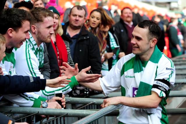 FA Trophy Final at Wembley Stadium.
North Ferriby United v Wrexham.
Ferriby's captain Liam King celebrates with the fans.
29th March 2015.
Picture Jonathan Gawthorpe.