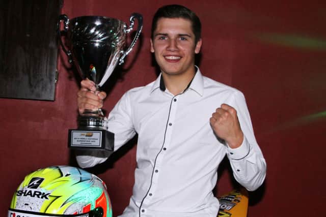 Kyle Ryde with his championship trophy from last season.