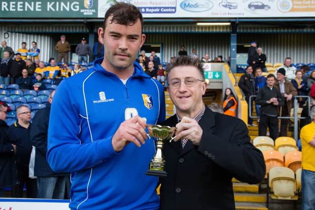 Matt Rhead received the Chad Player of the year award from John Lomas