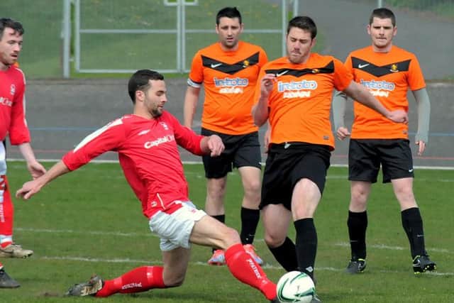 League Final action between Derwent FC (in Orange & Black kit)  V
Unwin Rovers (Red & White kit), held at Forest Town welfare.