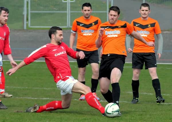 League Final action between Derwent FC (in Orange & Black kit)  V
Unwin Rovers (Red & White kit), held at Forest Town welfare.