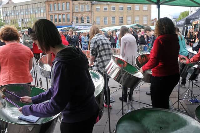 Mansfield Purple Flag event.              Market Place crowds are entertained by the Notts Performing Arts County Steel Pan Band.