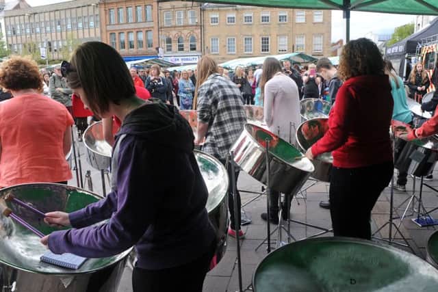 Mansfield Purple Flag event.              
Market Place crowds are entertained by the Notts Performing Arts County Steel Pan Band.