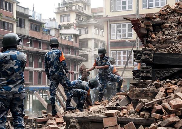 EARTHQUAKE TERROR -- the rescue operation begins in Kathmandu (PHOTO BY: Carl Whetham/Red Cross/PA Wire).