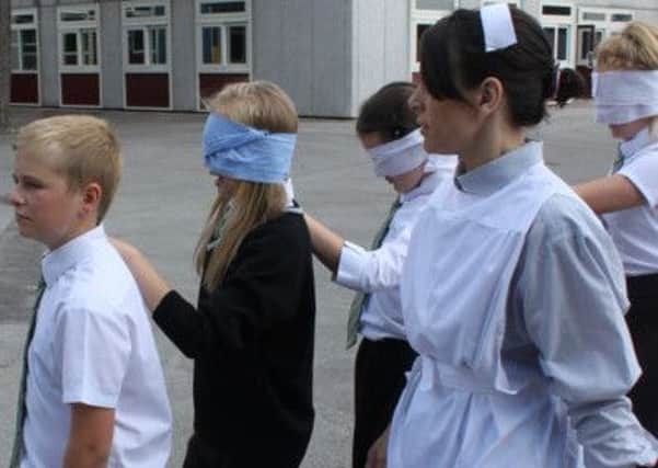 Students at Garibaldi College take part in  a First World War field hospital activity to commemorate the centenery of the conflict.