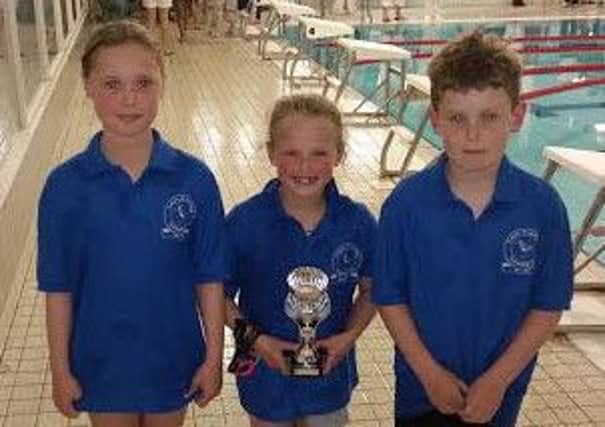 Sutton debutants Isabelle Berta, Rhyanne Pascoe and Tobey Smith with the third place trophy.