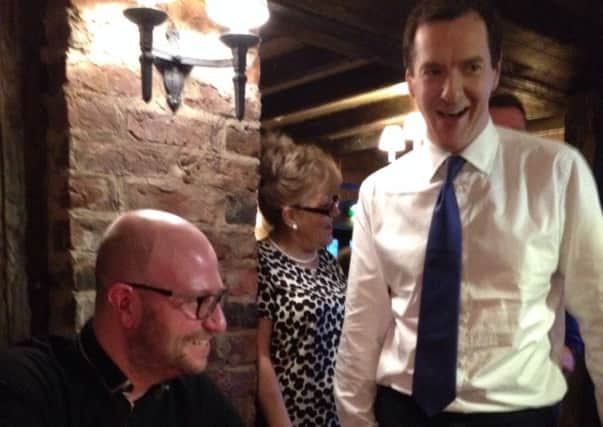 George Osborne wishes happy birthday to a surprised diner at The Hutt, Ravenshead