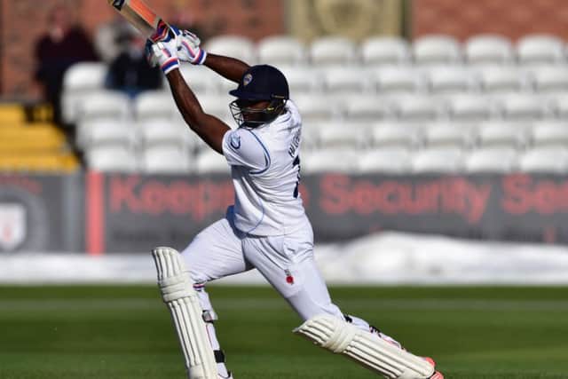 Chesney Hughes following through a drive during Derbyshire County Cricket Club second innings at 3aaa County ground, Derby on 11 May 2015. Photo: Simon Trafford