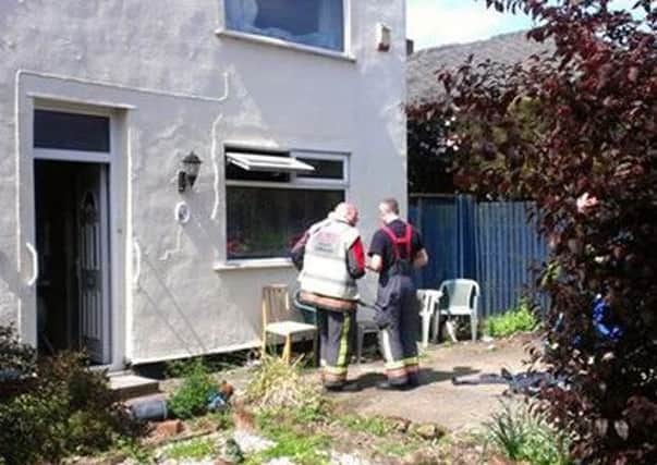 Firefighters at the scene of the house blaze in George Street, Mansfield