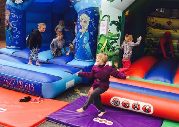 Young revellers enjoy the bouncy castles at a fundraiser for five year old  Johua Smith at the Forest Town Arena. Joshua suffers from a rare brain condition and his family are fundraising to take him on what could be his last holiday.
