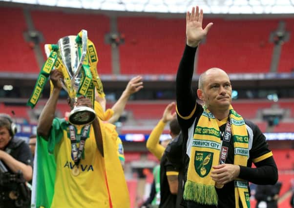 Norwich City manager Alex Neil (right) acknowledges the fan. Nick Potts/PA Wire.