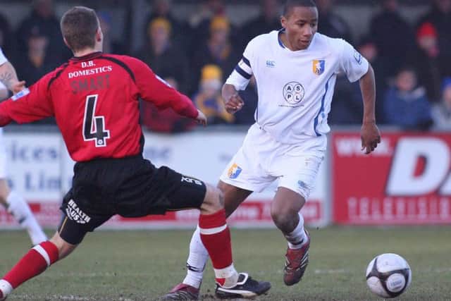 Jon D'Laryea eludes Eastbourne's MAtt Smart