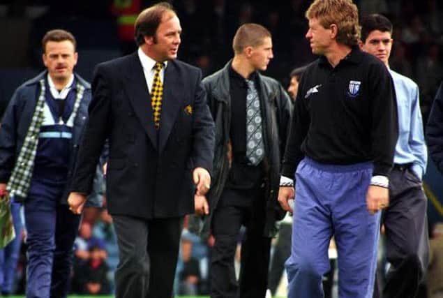 Andy King talking to Gillingham manager Mike Flanagan, in 1995.Picture by Dan Westwell.