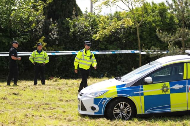 Police at the scene on Westfield Lane in Mansfield after a body was found in the search for missing Amber Peat.
