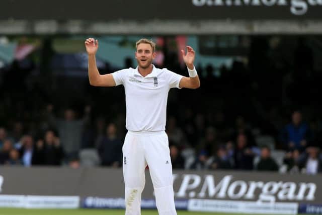 England's Stuart Broad celebrates as New Zealand's Trent Boult is caught by Moeen Ali.