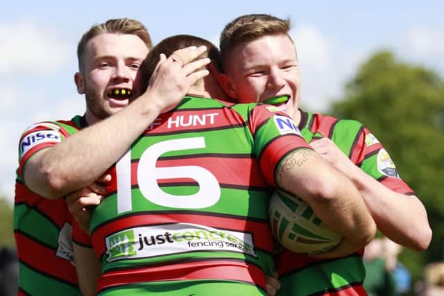 Players congratulate Aaron Bainbridge after scoring a superb try - Pic by: Richard Parkes