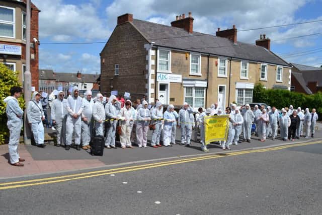 n Saturday 6th June 60 people from members of local schools and Churches, part of the Maun Valley Citizens (MVC) alliance came together to take a public stand against what they call toxic practices of Haven Supported Housing. Sixty people dressed in anti-contamination overalls and carrying a banner that read, Haven Homes are Toxic walked to the company director John Haddrells offices on St Johns Street in Mansfield where they held a silent protest.