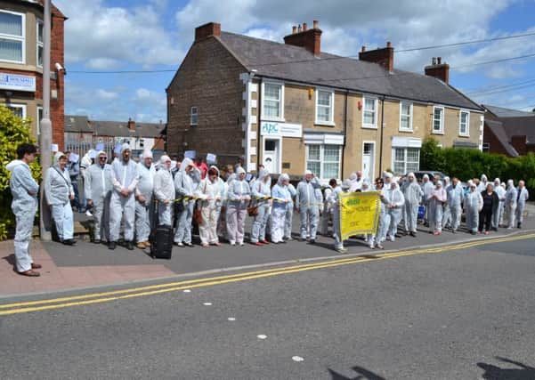 n Saturday 6th June 60 people from members of local schools and Churches, part of the Maun Valley Citizens (MVC) alliance came together to take a public stand against what they call toxic practices of Haven Supported Housing. Sixty people dressed in anti-contamination overalls and carrying a banner that read, Haven Homes are Toxic walked to the company director John Haddrells offices on St Johns Street in Mansfield where they held a silent protest.