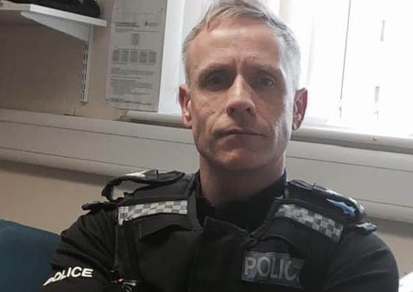 Sgt Simon Scales