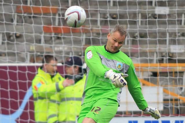 Brian Jensen with possibly his final touch as a Burnley player.