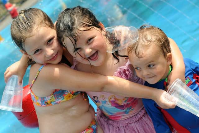 Shakira Ward, Codie Gaskin and Ethan Gaskin keep their cool at the Bulwell Bogs water park as temperatures soar on Wednesday.