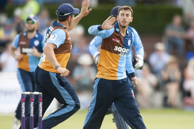 Derbyshire v Northamptonshire SteelbatsAlex Hughes is congratulatedafter taking a wicket at Queens PArk