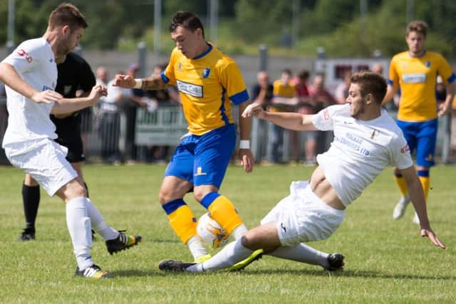 Mansfield vs Rainworth - Craig Beardsley battling for the ball - Pic By James Williamson