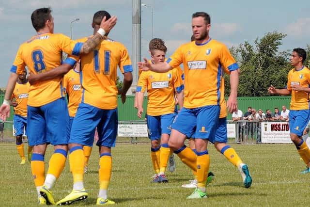 Rainworth Miners Welfare FC took on Mansfield Town at Rainworth , playing for the 'Green Energy trophy'. Stags celebrate the first goal